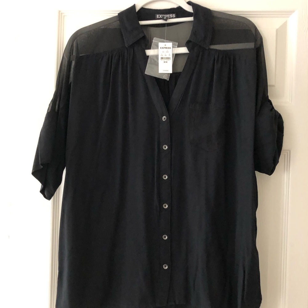 Straight cut top with roll up sleeve.